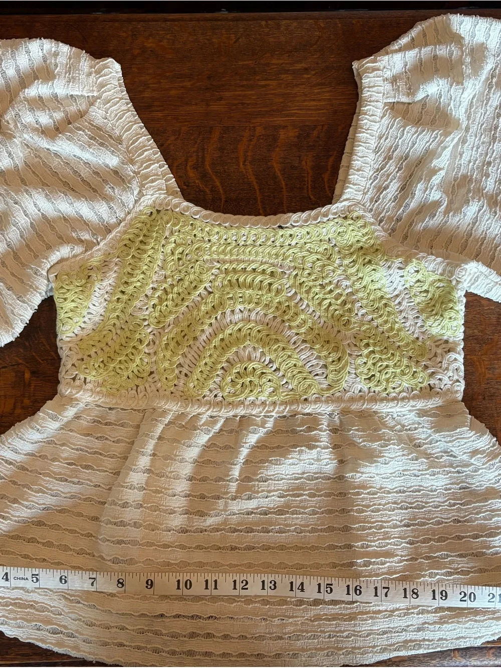 Anthropologie Cream Knit Peplum Top with Lime Crochet Yoke
